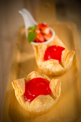 Strawberry jam pie, fresh homemade bakery on wooden background, selective focus