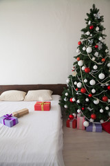 Christmas new year tree Interior bedroom and bed with gifts