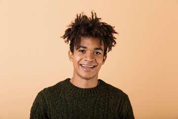 Portrait of a happy young africa man dressed in sweater