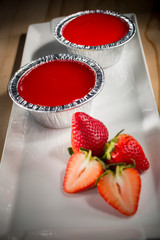Strawberry Cupcake, homemade bakery pastry with fresh strawberry on white dish, selective focus