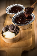 Soft cake, Chocolate Fudge Cupcake, Homemade bakery pastry on wooden background, selective focus