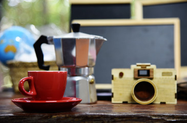 Red coffee and Wood camera on the table