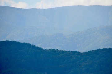 Mountain range hill in soft focusing in blue-green tone color