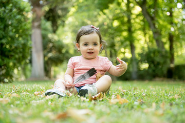 Pretty baby posing in the park
