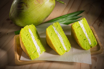 Homemade bakery, Pandan with coconut cream chiffon cake on a wooden background, selective focus