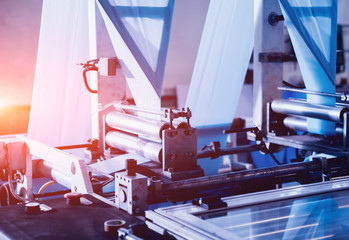 Modern automated production line in factory. Plastic bag manufacturing process