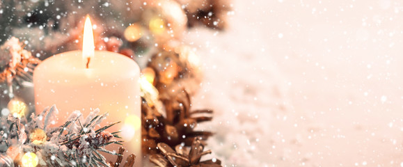 Christmas banner. Burning candle and cones on snow background