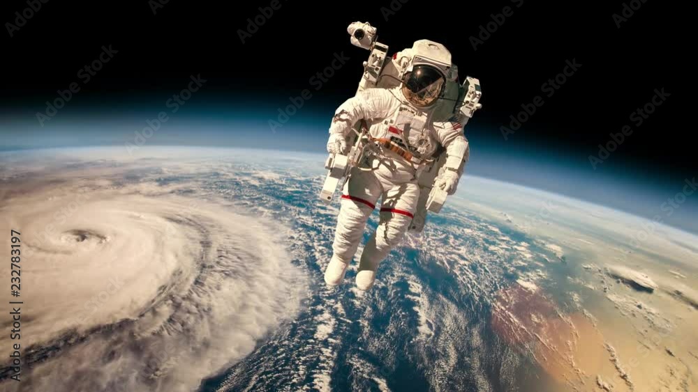 Poster astronaut in outer space against the backdrop of the planet earth. typhoon over planet earth. elemen