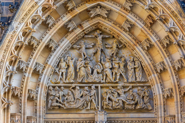 Portal of the main entrance of Saint Vitus Cathedral, representing the crucifixion of Jesus Christ, Prague, Czech Republic