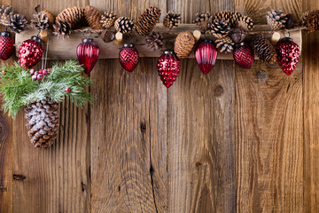 Christmas greeting card. Festive decoration on wooden background. New Year concept. Copy space.  Flat lay. Top view.