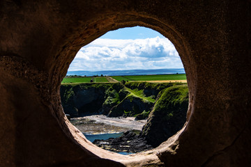 Coastline through a round window, Scotland