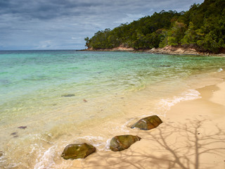 stones on the sand of tropical beach