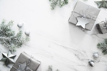 Christmas and New Year holiday background. Xmas greeting card. Christmas gifts on white marble background top view. Flat lay