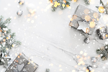 Christmas and New Year holiday background. Xmas greeting card. Christmas gifts on white marble background top view. Flat lay