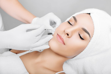 Fototapeta na wymiar woman having facial injections for facelift and anti-aging effect