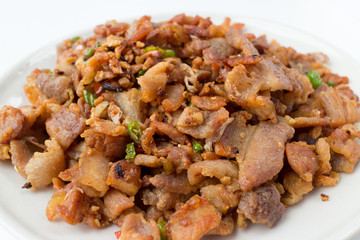 fried pork belly with fish sauce isolated on white background