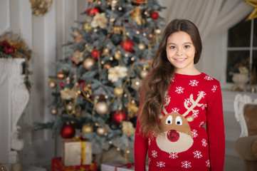 little child girl likes xmas present. Happy new year. small happy girl at christmas. Christmas. Kid enjoy the holiday. The morning before Xmas. New year holiday. Merry Christmas and Happy New Year