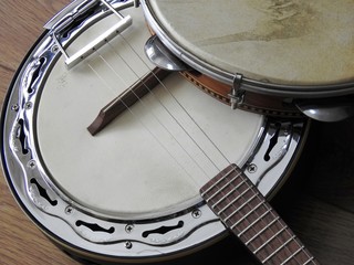 Close-up of two Brazilian musical instruments: samba banjo (strings) and pandeiro (percussion)....