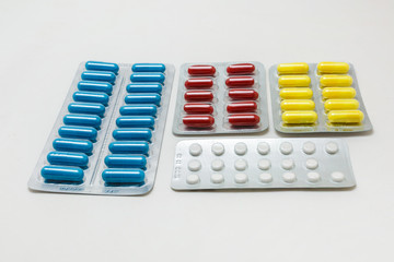 pill packaging and medical supplies on white background