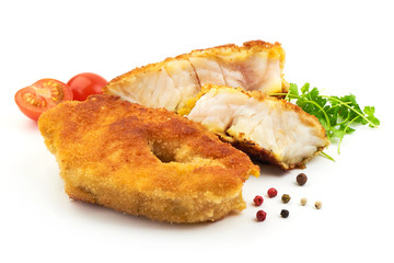 Traditional English food, Fried Fish with herbs, pepper and tomatoes, isolated on a white background. Close-up