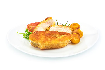 Traditional English food, Fried Fish with herbs, pepper and tomatoes, isolated on a white background. Close-up