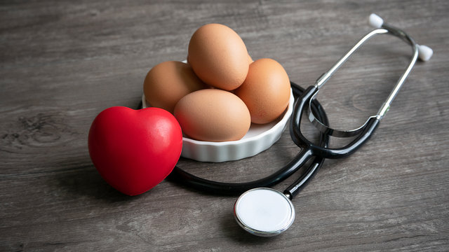 group of eggs with red ball foam with shape heart and stethoscope in healthy eating