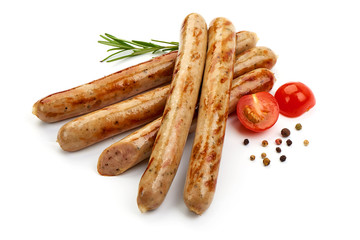 Grilled White Sausages with herbs, pepper and tomatoes, isolated on a white background. Close-up.