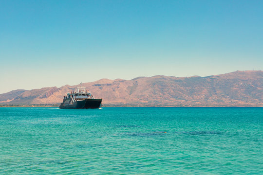 A ferry boat crossing the crystal water near Elafonissos Island,  Elafonissos, Laconia region, Peloponnese, Greece, Europe
