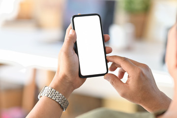 Cropped shot male hand holding blank screen mobile phone