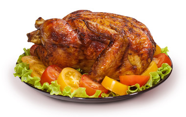 Whole fried chicken or Turkey with vegetables and lettuce on white isolated background.