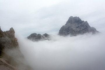 peak of the mountain in mist, Alps