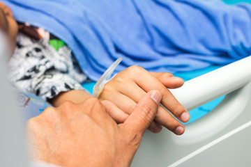 IV solution in a child's patients hand