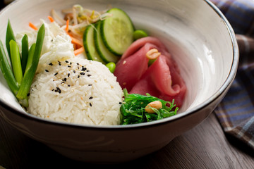 Asian food: rice with sesame and tuna in a restaurant