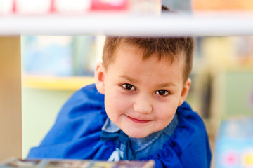 funny boy playing in kindergarten