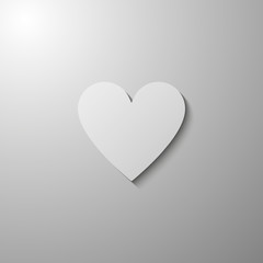 White heart icon. Symbol of love with shadow. Vector illustration in flat design isolated on gray gradient background with light from above.