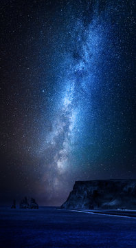 Milky way over black sand beach at night, Iceland
