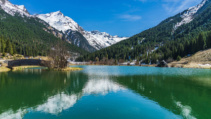 Naklejka na ściany i meble reflections in a mountain lake
