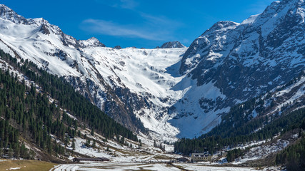 view of alps in winter in a glacier valley