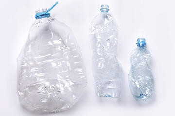 Concepts of pollution and recycling. Different used plastic bottles