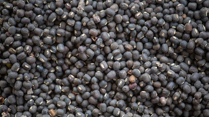 Black pepper background of peppercorns