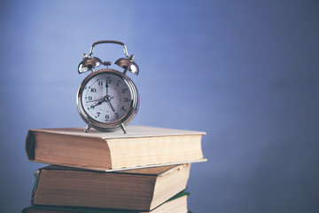 vintage clock on book