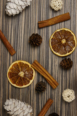 Christmas composition with spices and branches on wood