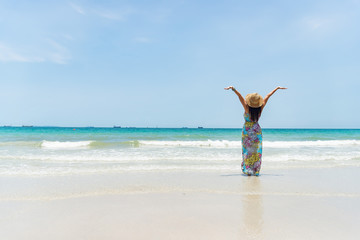 Happy woman at the beach enjoying her summer holidays Lifestyle. Travel and lifestyle Concept happy