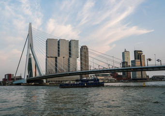 Evening Rotterdam Skyline with the Ship under Erasmus Bridge Kop van Zuid neighborhood, The Netherlands