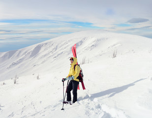 Fototapeta na wymiar Alpine touring skier in winter mountain