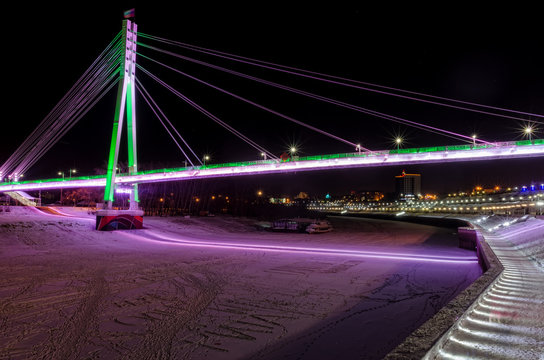 Lovers bridge in night time. Tyumen. Russia
