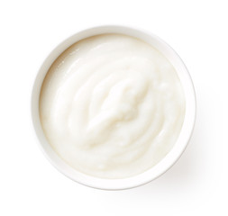 Bowl of baby porridge isolated on white, from above