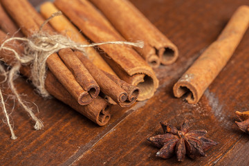 Cinnamon on wooden board.