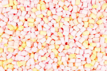 Marshmallow. Background of pink and yellow colorful mini marshmallows.
