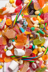 Colorful candies on wooden background